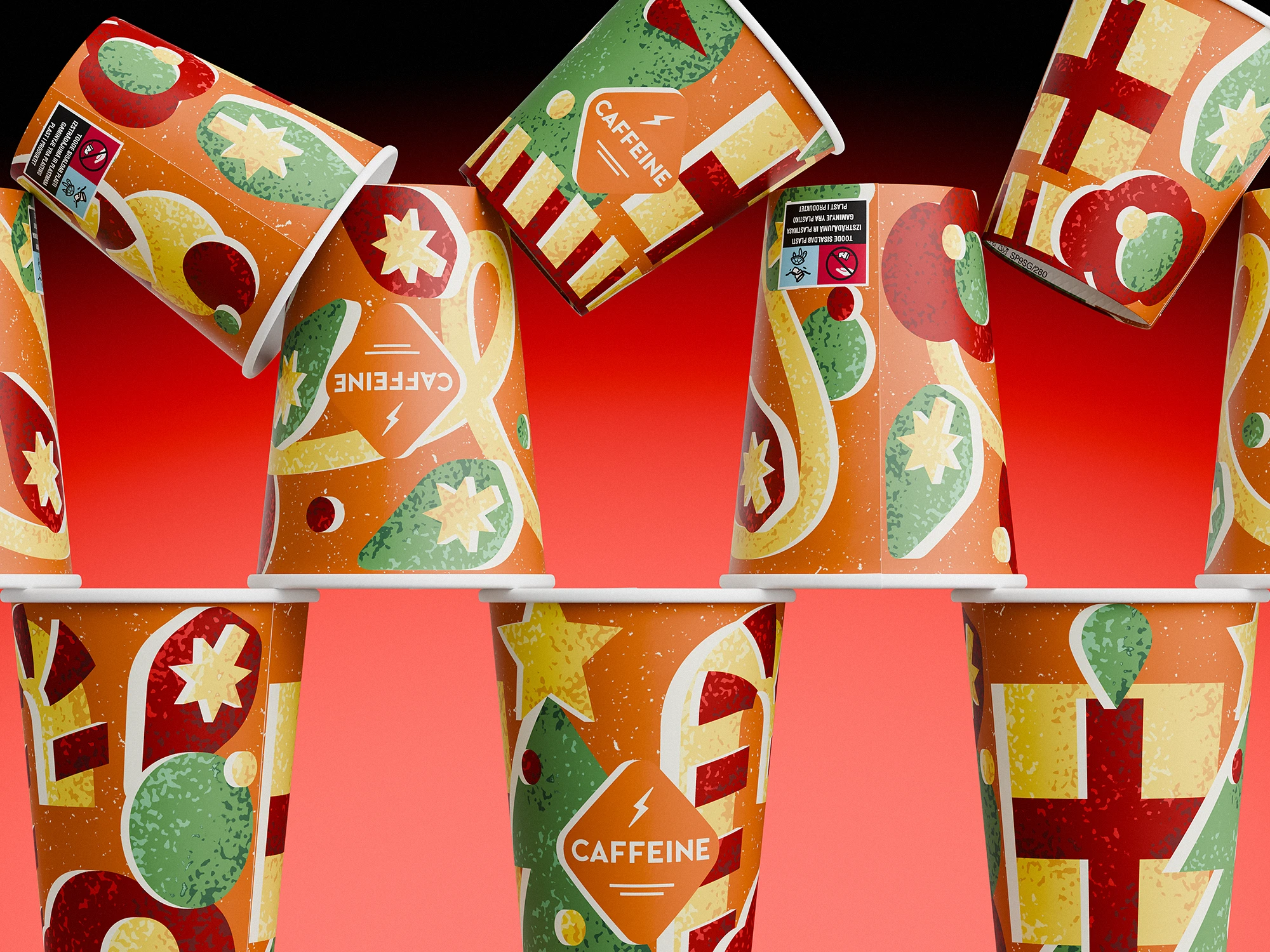 Stack of CAFFEINE Christmas edition paper cups (2024) arranged in a playful pyramid against a red background. The cups feature an orange base with festive illustrations: stars, baubles, ribbons, candy-cane stripes, and wrapped gift patterns in green, red, and yellow. The CAFFEINE logo is placed in the center of each cup inside a diamond shape.