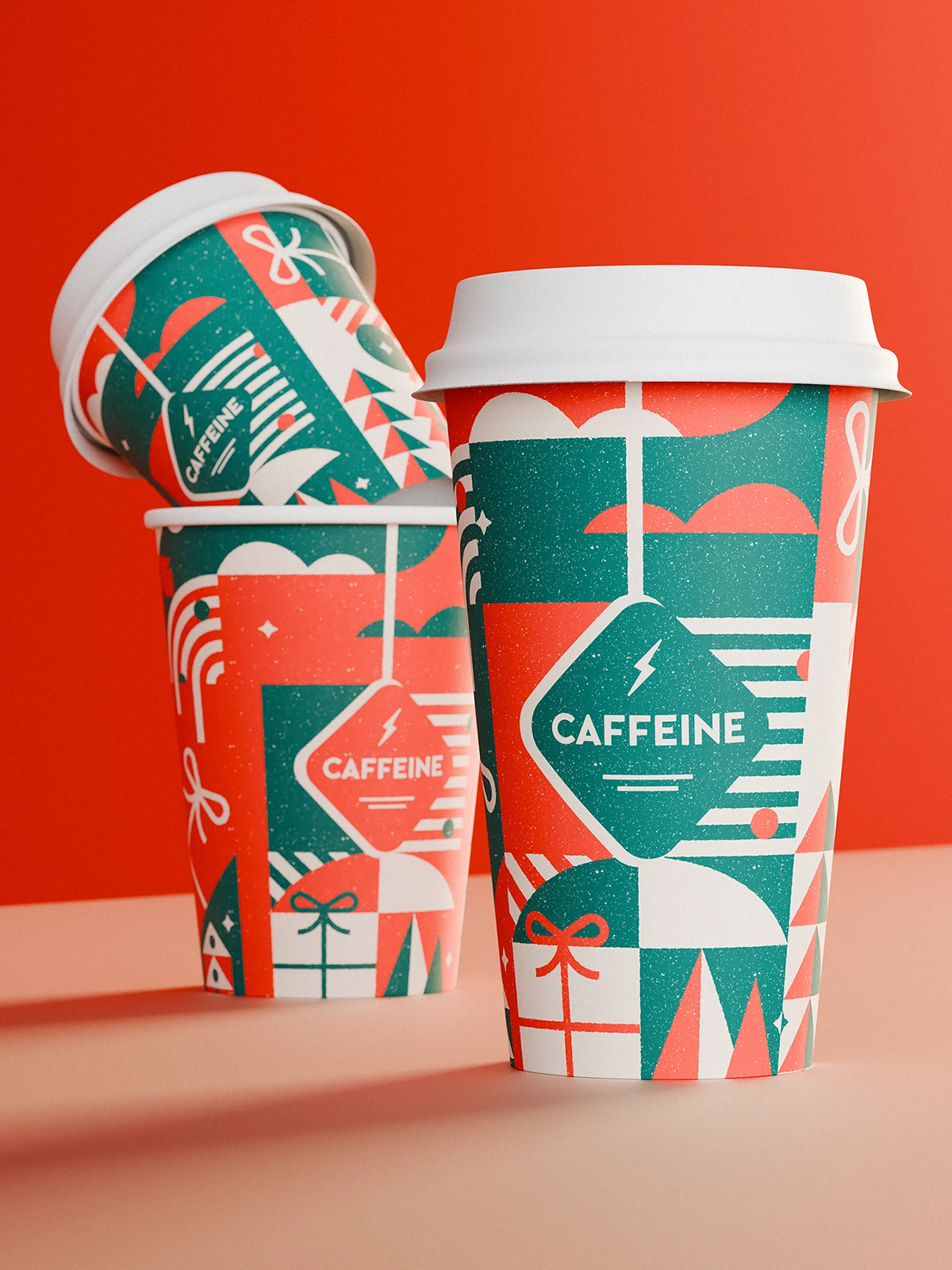 Three paper coffee cups with white lids, decorated in a festive geometric pattern in green, red, and cream, featuring gift boxes, trees, stars, and the “CAFFEINE” logo, set against a red background.
