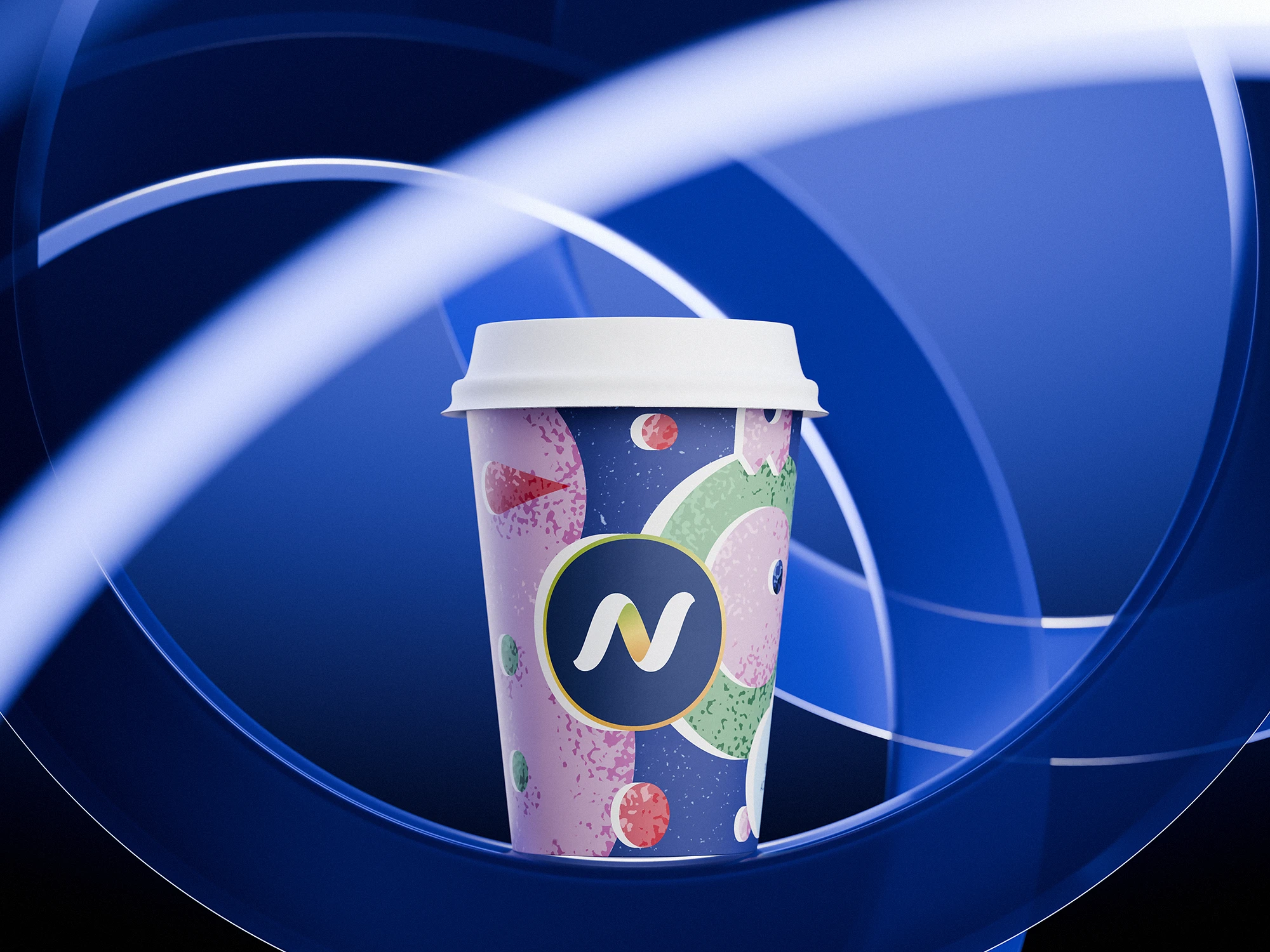 Narvesen Christmas edition paper cup (2024) placed at the center of a blue abstract background with circular light streaks. The cup has a white lid and a festive design in navy, pink, green, and red with textured shapes. The Narvesen “N” logo is prominently displayed in the middle on a dark blue circle outlined in yellow.