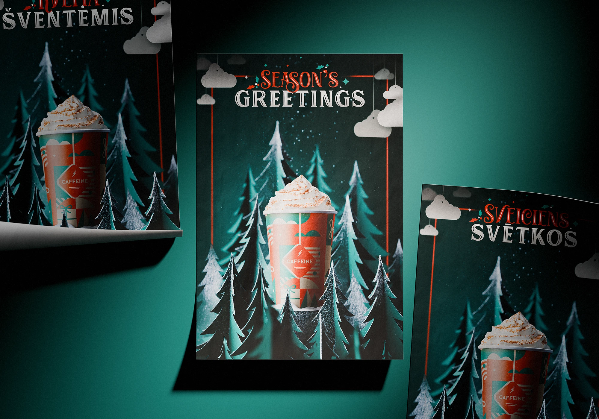Posters with Caffeine’s 2021 Christmas cup design, featuring a festive paper cup topped with whipped cream, surrounded by cut-out paper pine trees and small paper clouds, all arranged and photographed as a real composition. The central poster reads “SEASON’S GREETINGS” in bold vintage-style typography.