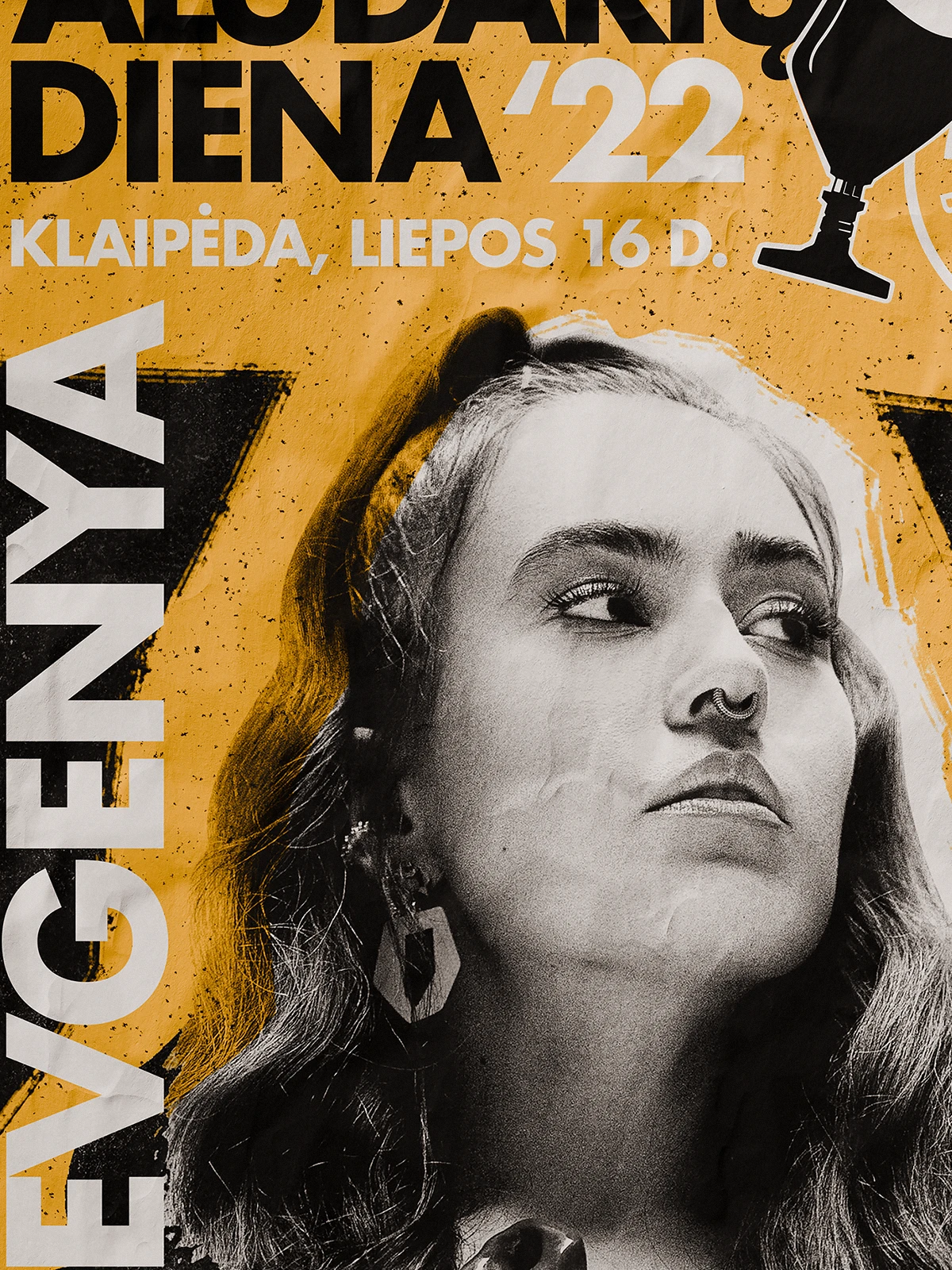 Close-up of a festival poster for Aludarių Diena ’22 in Klaipėda, featuring a black-and-white portrait of a woman against a textured yellow background. The bold typography and graphic contrast reflect a rock-inspired, expressive visual identity for the event.
