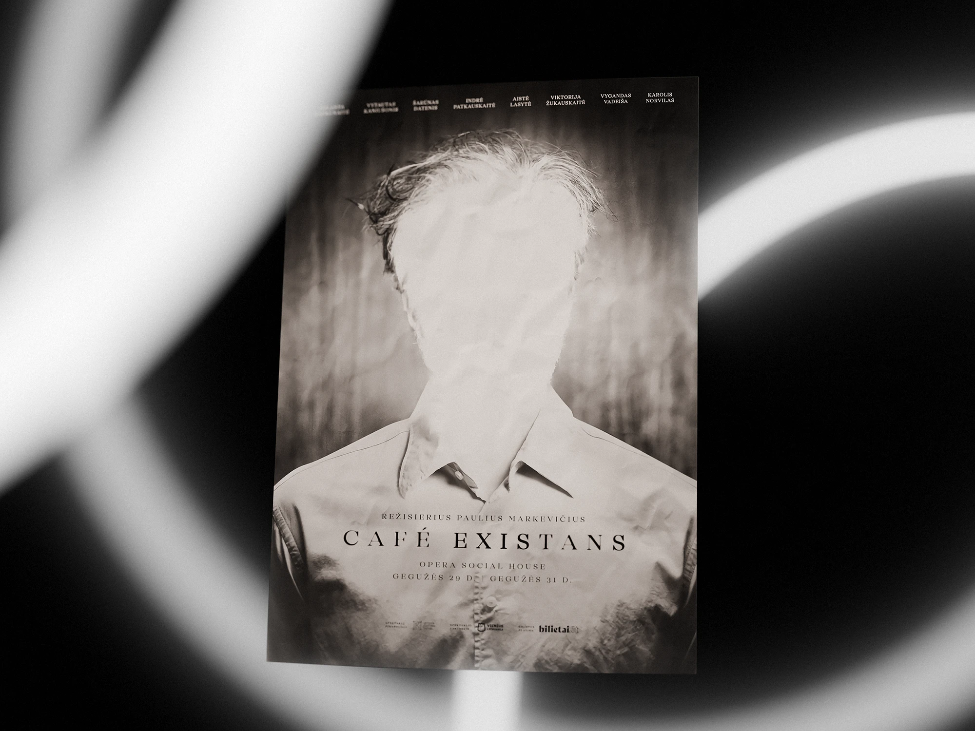 Poster for Café Existans — a contemporary theatre performance directed by Paulius Markevičius. The design features a monochrome photograph of a person with an overexposed, faceless head, creating a haunting, surreal atmosphere. Soft white light trails move across the composition, adding to the sense of mystery and existential tension.