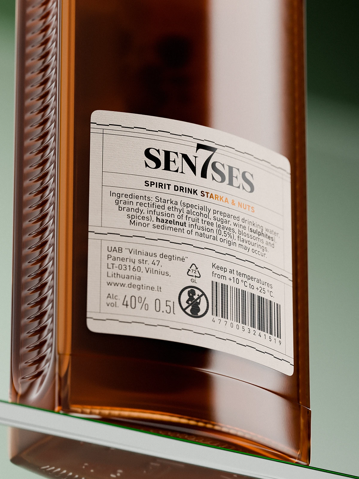 Back label of a 7Senses Starka & Nuts bottle on amber glass, showing a curved white paper label with ingredient list, alcohol content (40% vol., 0.5 l), storage instructions, recycling symbols, barcode, and producer details, photographed close-up with soft reflections and shallow depth of field.